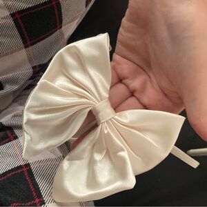 Size 11 white heels with bow in back never worn just tried on.